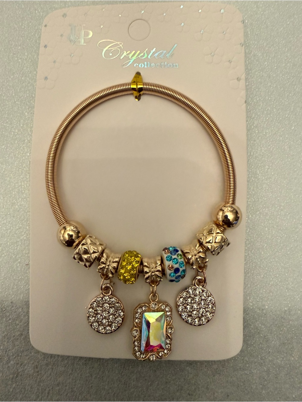 Gold-Tone Multi-Charm Bracelet with Yellow & Blue Accents